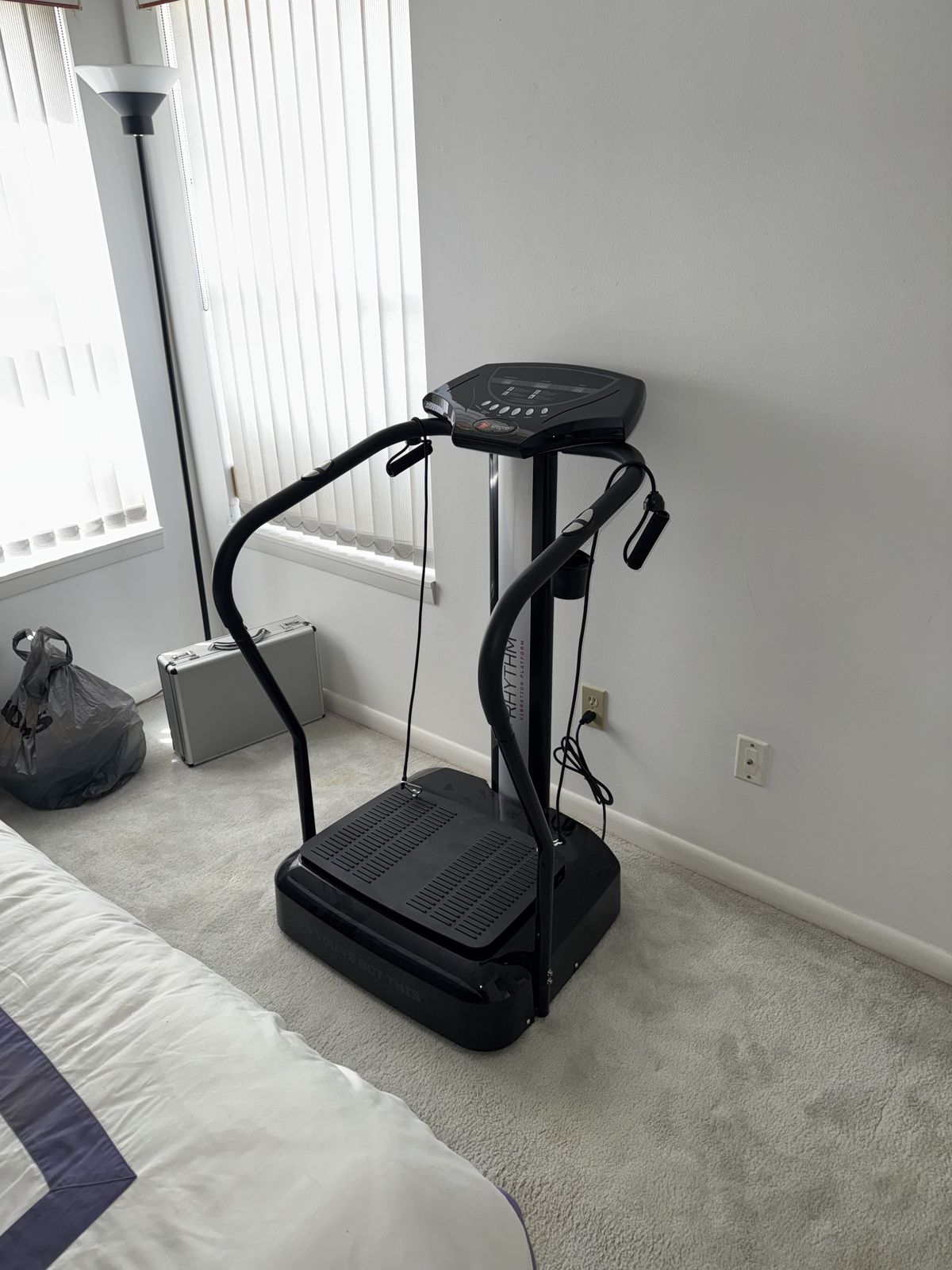 Vibration plate exercise machine assembled and set up in a bedroom